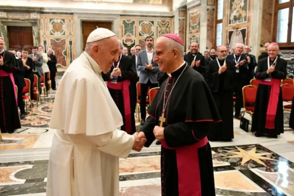 Pope Francis greets Archbishop Rino Fisichella in the Vatican's Clementine Hall, Sept. 17, 2021. Vatican Media.